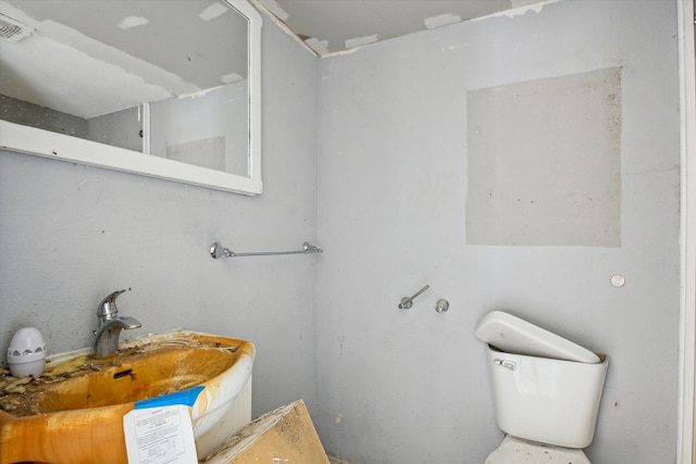 bathroom featuring sink and toilet