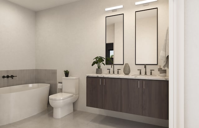 bathroom with toilet, vanity, tile patterned floors, and a tub