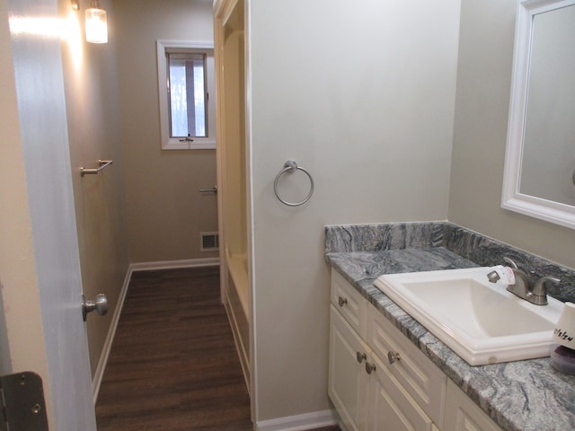 bathroom featuring hardwood / wood-style floors and vanity