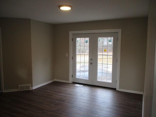 entryway featuring dark hardwood / wood-style flooring and french doors