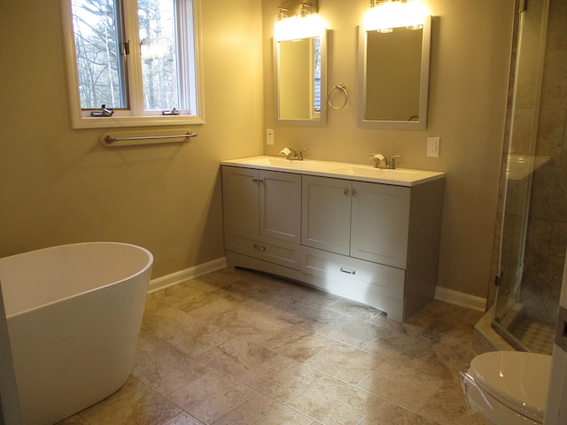 full bathroom featuring shower with separate bathtub, vanity, and toilet