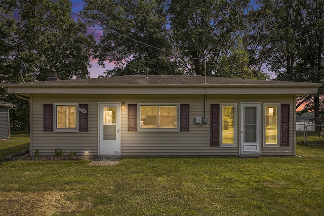 view of front of home with a yard