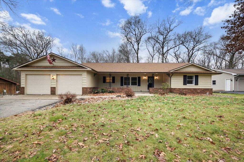 ranch-style house with a front lawn and a garage