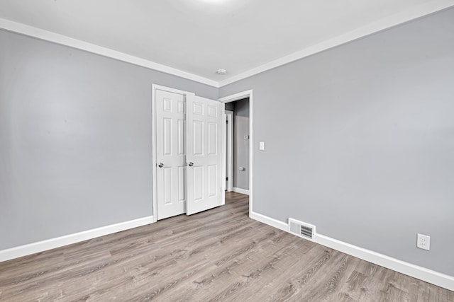 unfurnished bedroom with light wood-type flooring