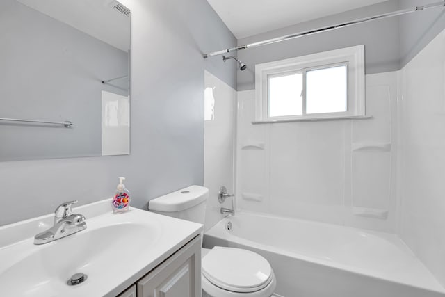 full bathroom with vanity, toilet, and washtub / shower combination