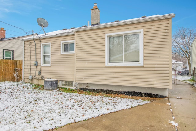 view of side of property featuring central air condition unit