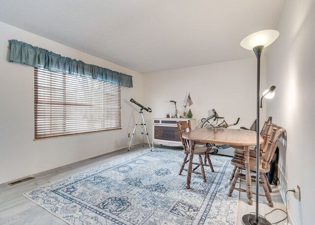 office space with wood-type flooring