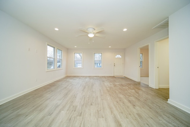 unfurnished room featuring ceiling fan and light hardwood / wood-style flooring