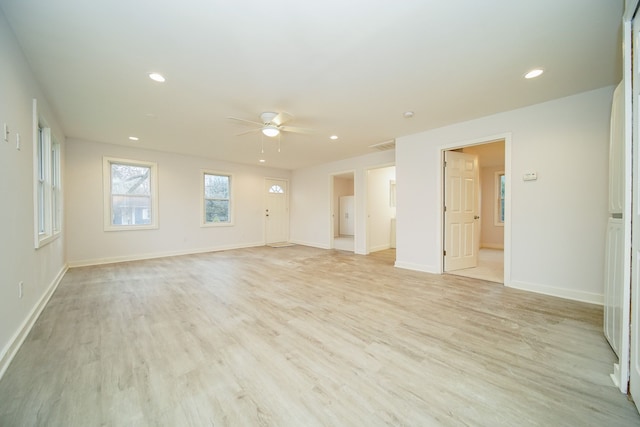 spare room featuring ceiling fan and light wood-type flooring