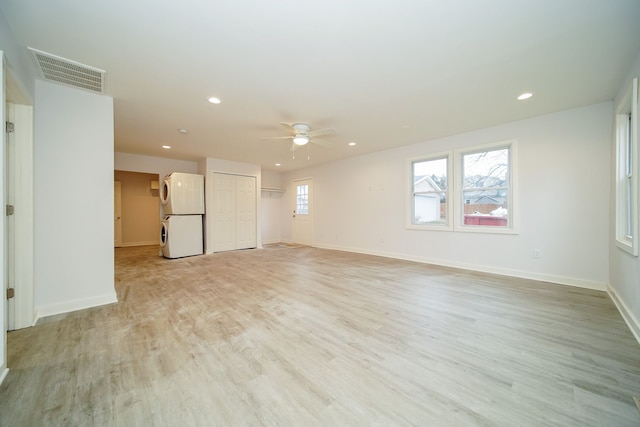 empty room with light hardwood / wood-style floors and ceiling fan