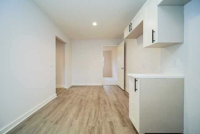 hallway with light wood-type flooring