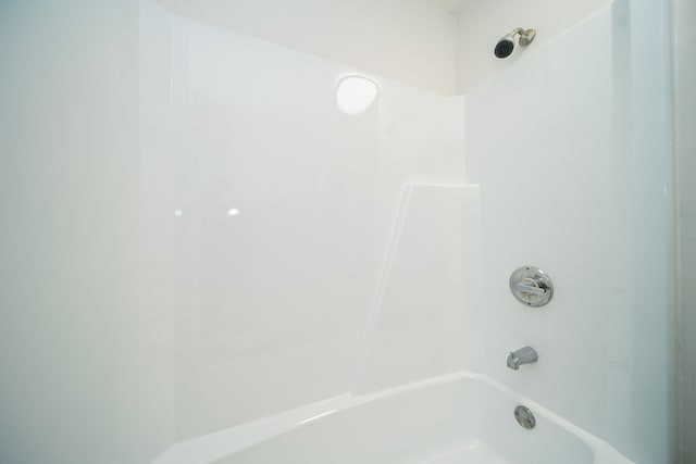 bathroom with shower / washtub combination