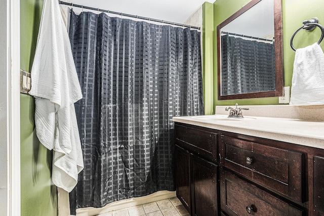 full bathroom with tile patterned flooring and vanity