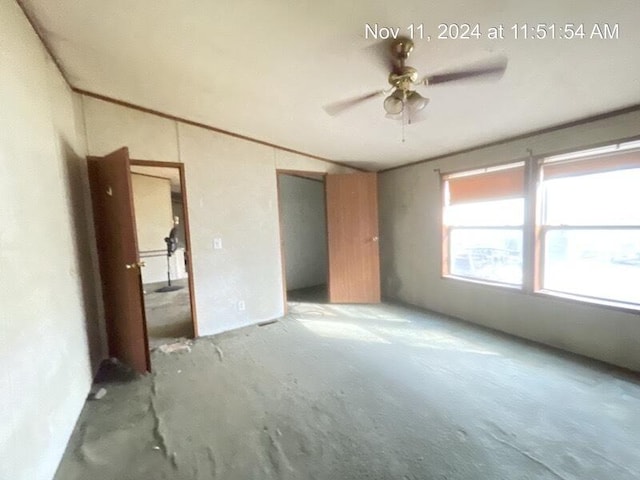 unfurnished bedroom featuring ceiling fan