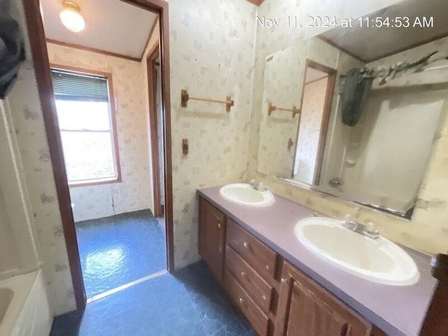 bathroom featuring tile patterned flooring and vanity