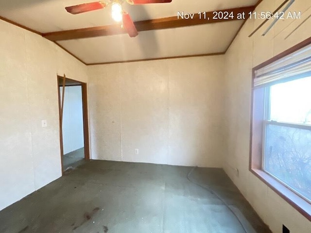 unfurnished room with ceiling fan, concrete flooring, and vaulted ceiling