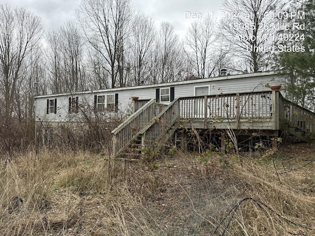 view of front of home with a wooden deck