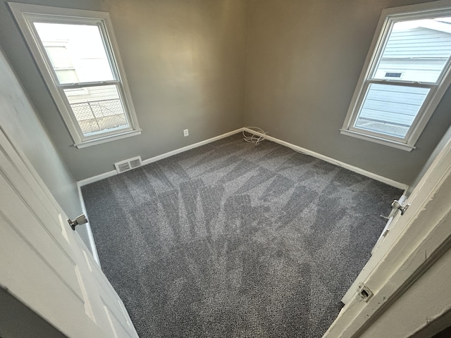 spare room featuring carpet