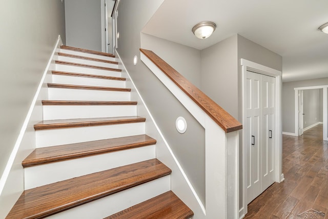 staircase featuring hardwood / wood-style floors