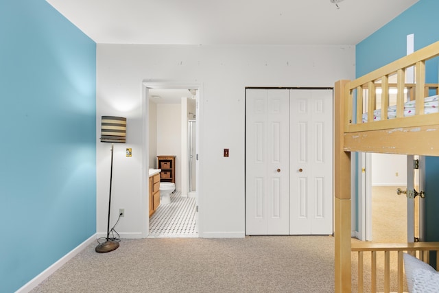 unfurnished bedroom with light carpet and a closet