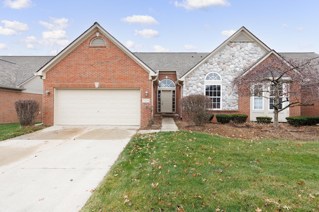 view of front of property featuring a garage and a front lawn