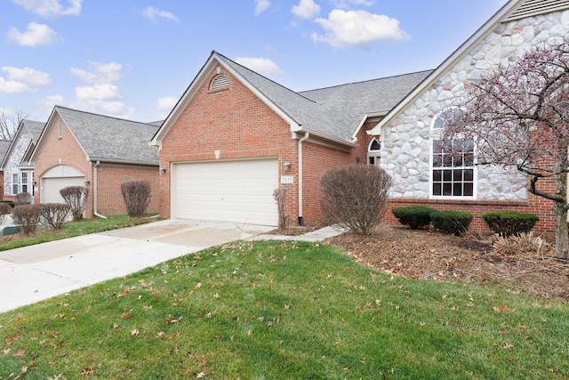 single story home featuring a garage and a front yard