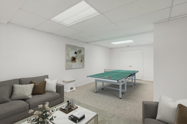 recreation room with carpet flooring and a paneled ceiling