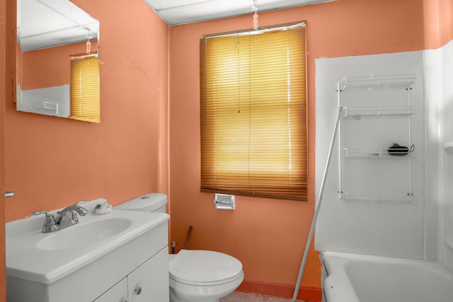 bathroom with vanity, toilet, and a bathtub