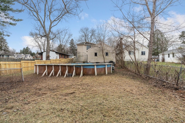 view of yard featuring a fenced in pool