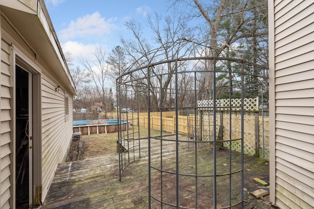 view of yard with a pool side deck