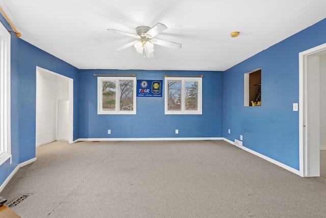 carpeted empty room with ceiling fan