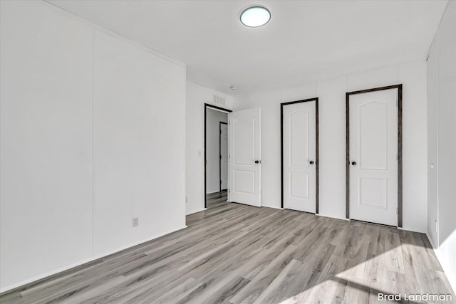 unfurnished bedroom with light hardwood / wood-style flooring