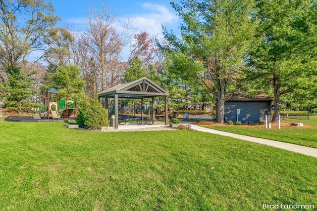 view of yard featuring a gazebo and a playground