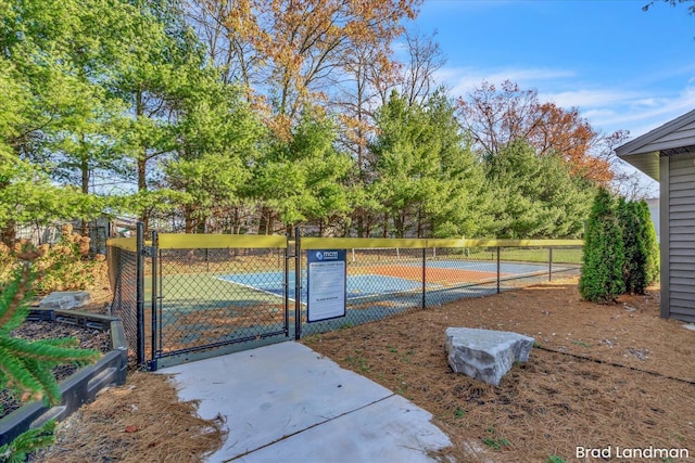 view of sport court featuring tennis court