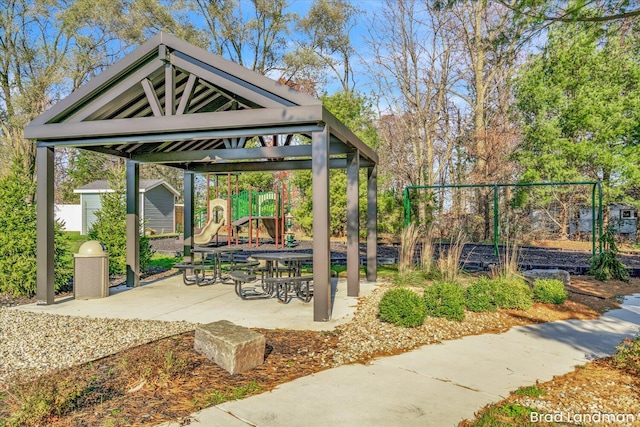 view of community with a playground, a patio area, and a gazebo