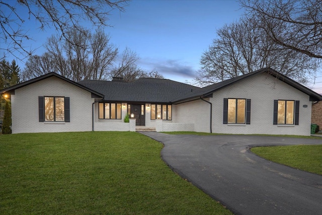 view of front of house with a yard