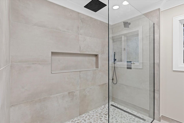 bathroom with a tile shower