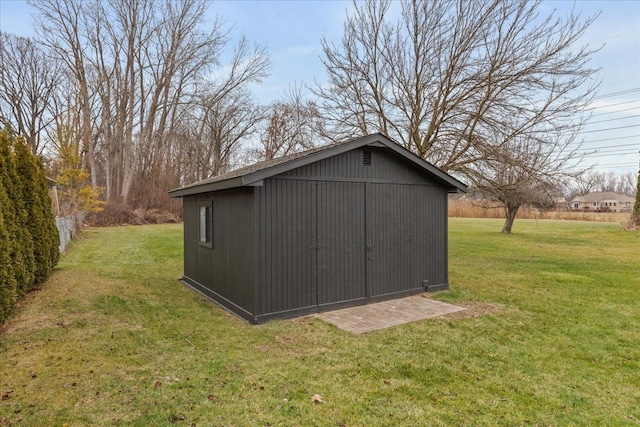 view of outdoor structure with a yard