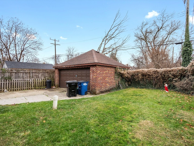 view of yard featuring a garage and an outdoor structure