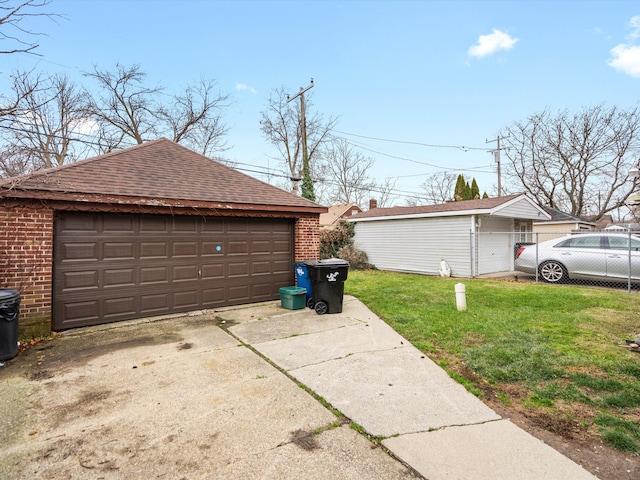 garage featuring a lawn