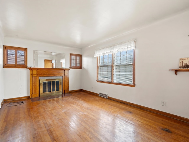 unfurnished living room with hardwood / wood-style flooring