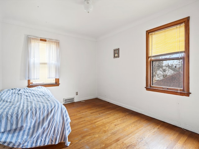 bedroom with light hardwood / wood-style floors