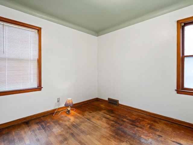 spare room featuring hardwood / wood-style flooring