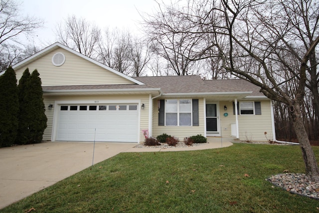 ranch-style house featuring a garage and a front yard