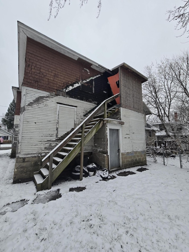 view of snow covered house