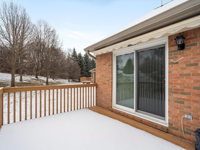 view of snow covered deck