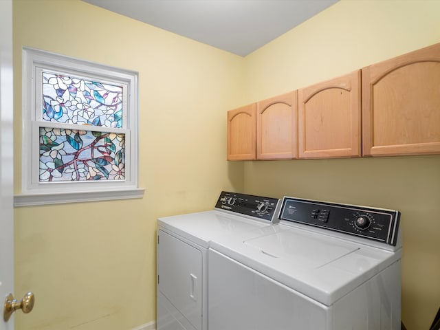 laundry room with cabinets and independent washer and dryer