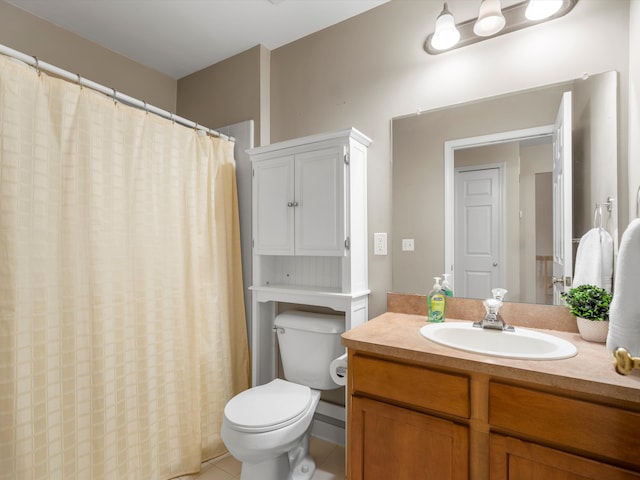 bathroom with tile patterned floors, vanity, and toilet