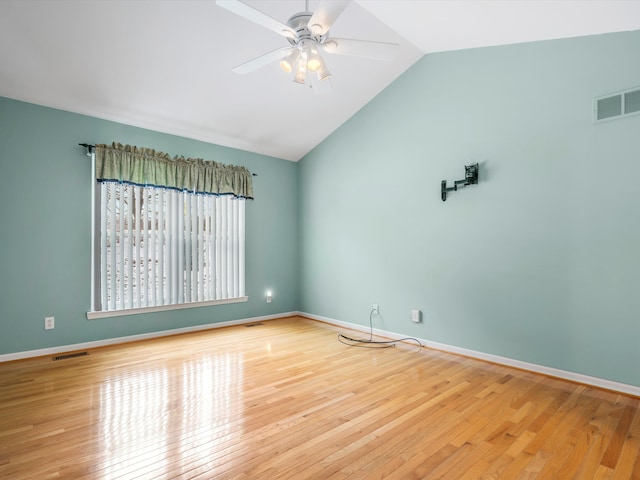 empty room featuring ceiling fan, light hardwood / wood-style floors, and lofted ceiling