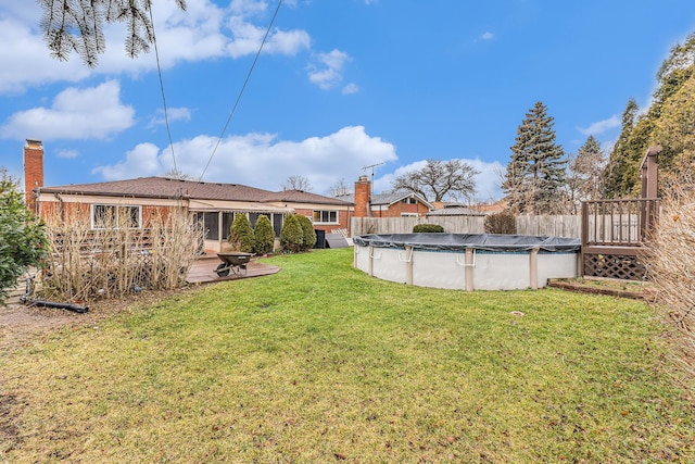 view of yard with a patio and a covered pool